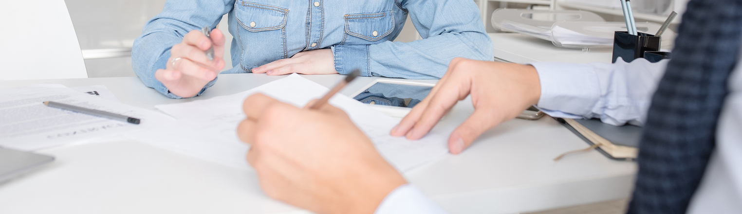 2 people going over some documents